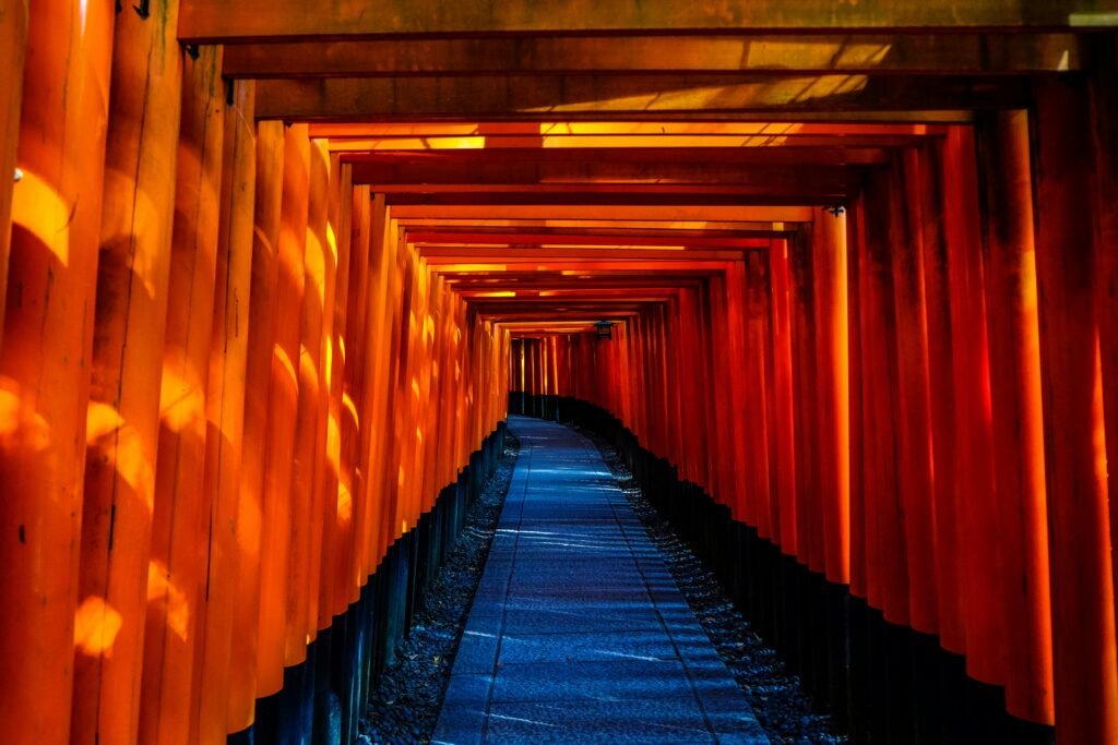 Explore the stunning orange torii gates of Fushimi Inari Taisha in Kyoto, Japan.