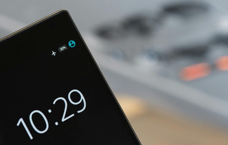 Focused image of a smartphone showing a 10:29 time with blurred background.