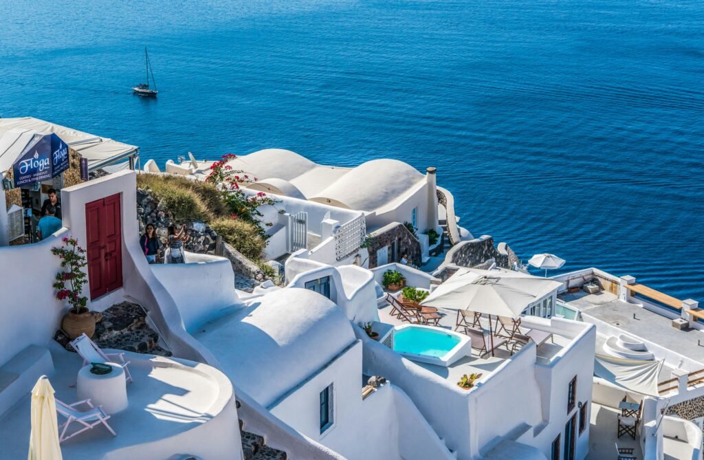 Whitewashed Santorini architecture overlooking the deep blue Aegean Sea.